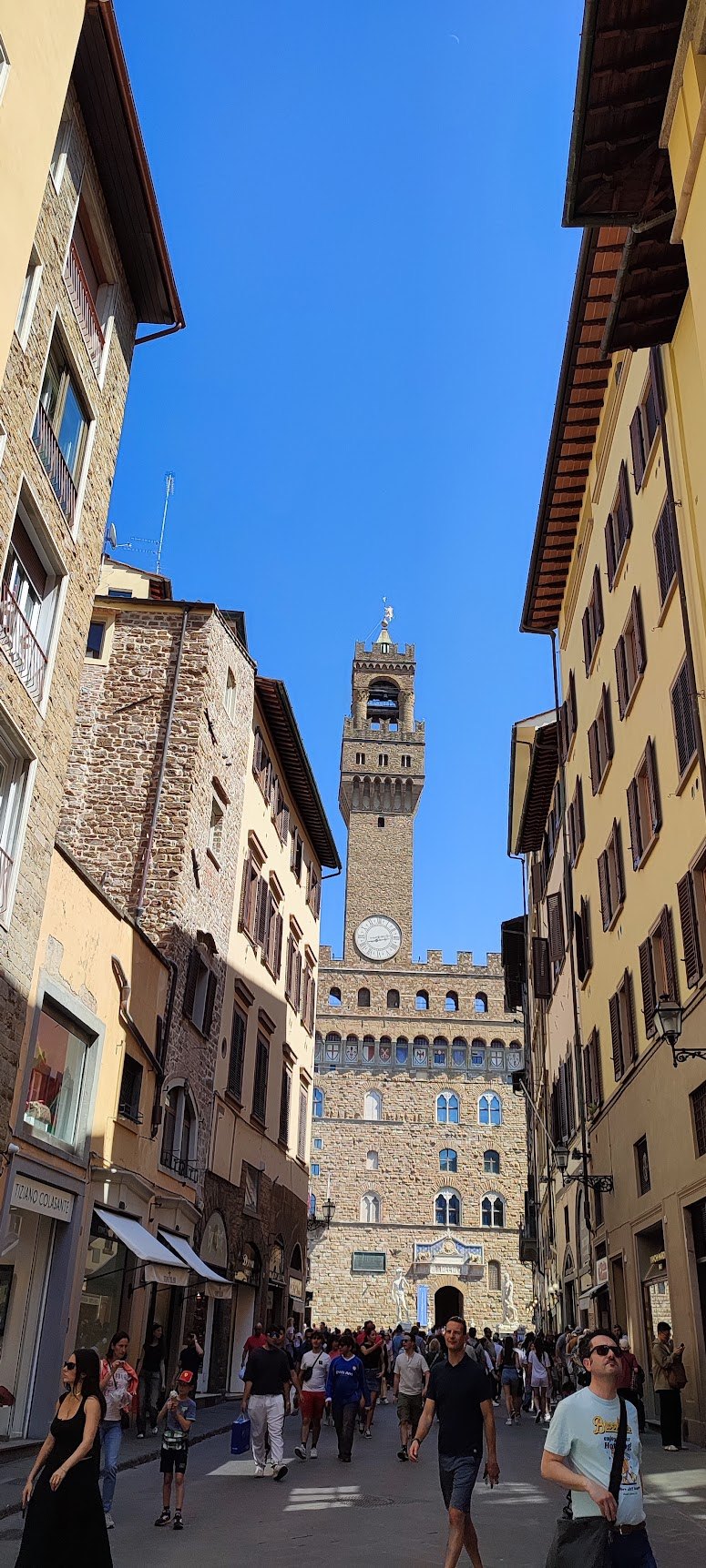 The off-center Arnolfo Tower rising above the facade of Palazzo Vecchio