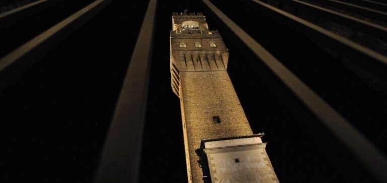 The Arnolfo Tower of Palazzo Vecchio lit at night in Florence
