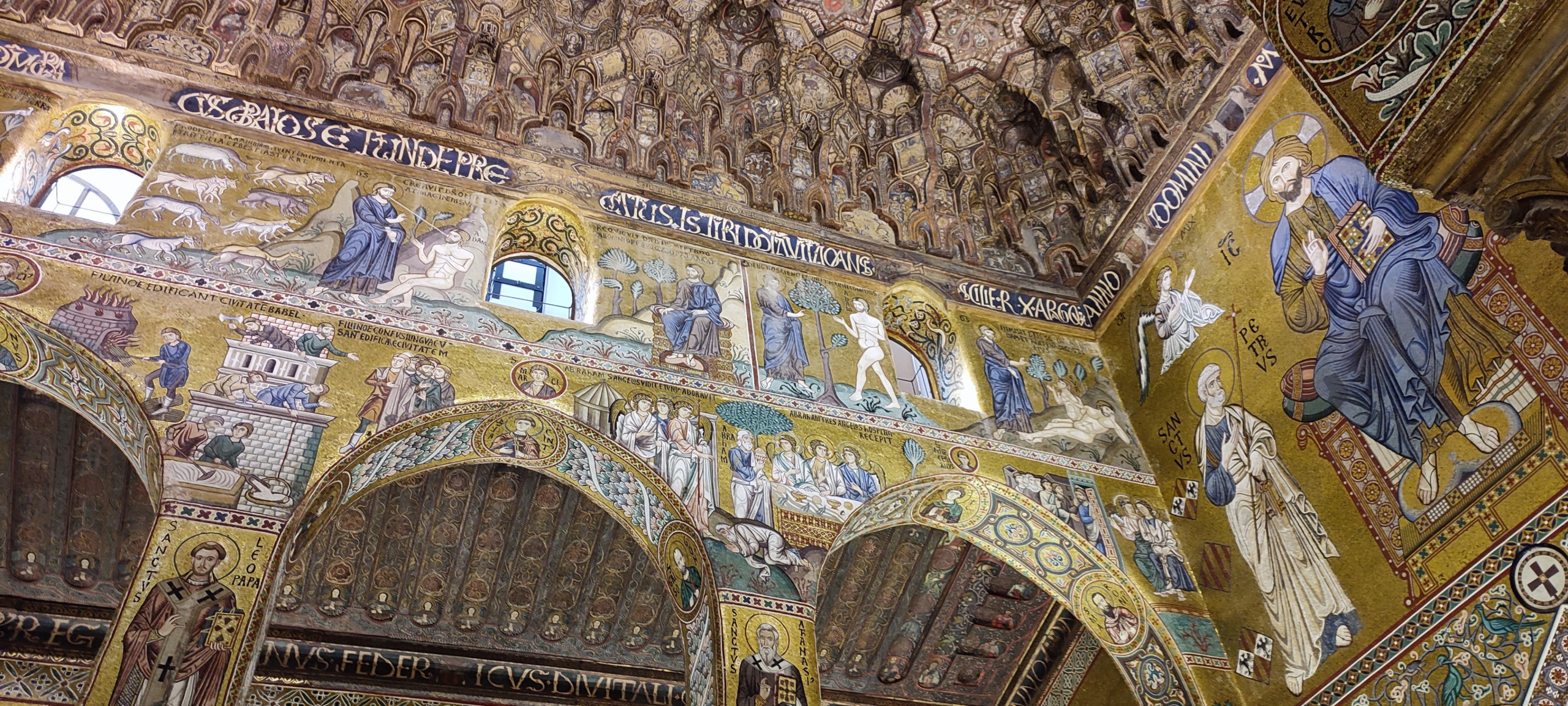 The painted muqarnas ceiling and Genesis mosaic band of the Cappella Palatina in Palermo