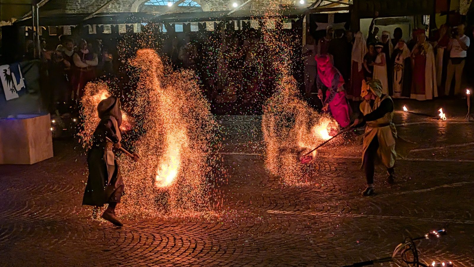 Focolieri di Este fire performers throwing sparks during La Sfera del Destino at Grottazzolina