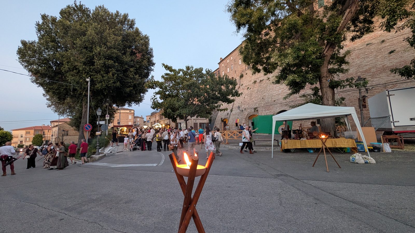 Burning brazier and medieval market below the castle walls of Grottazzolina during I Giorni di Azzolino