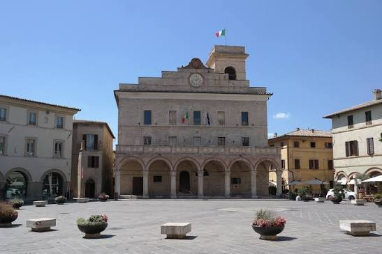 Palazzo Comunale and clock tower in Montefalco's main piazza, gateway to Sagrantino di Montefalco wine country