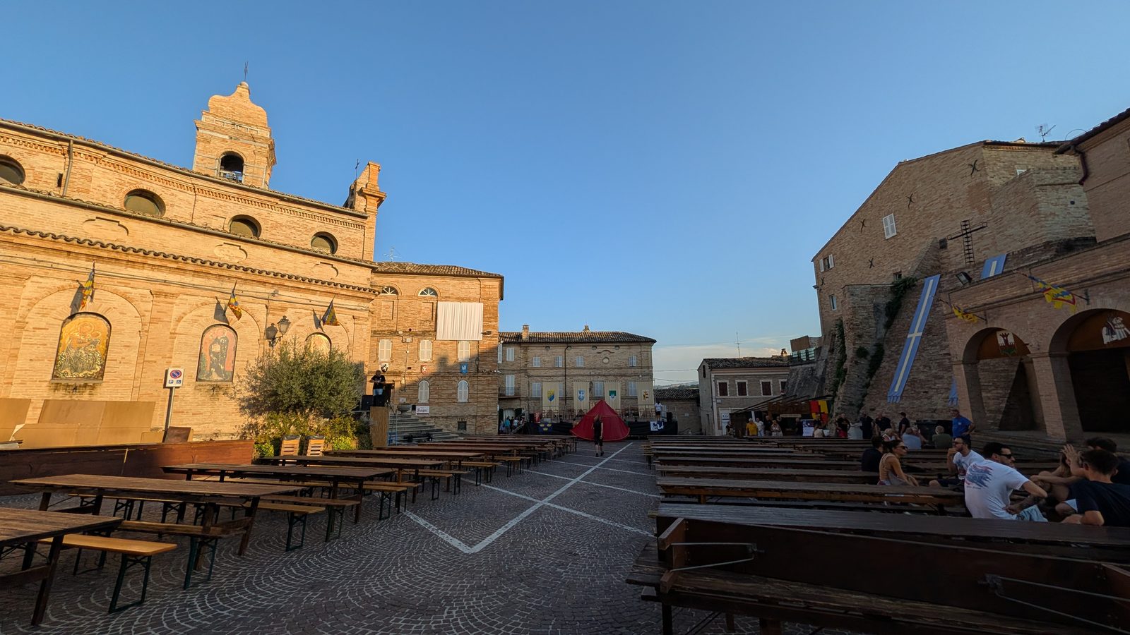 Long tavern tables set up in the main piazza of Grottazzolina before the medieval dinners begin