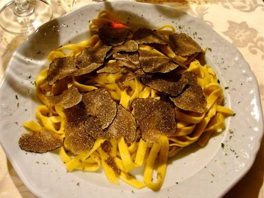 Fresh tagliolini pasta topped with shaved black truffle