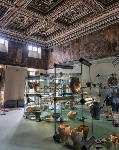 Display cases of Attic pottery inside the Ancona archaeological museum