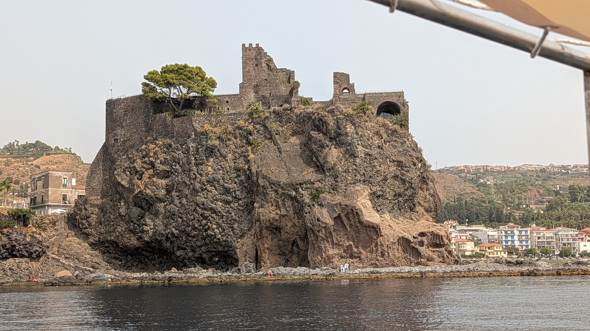 A Norman-era castle built on black volcanic rock at Aci Castello, near Catania