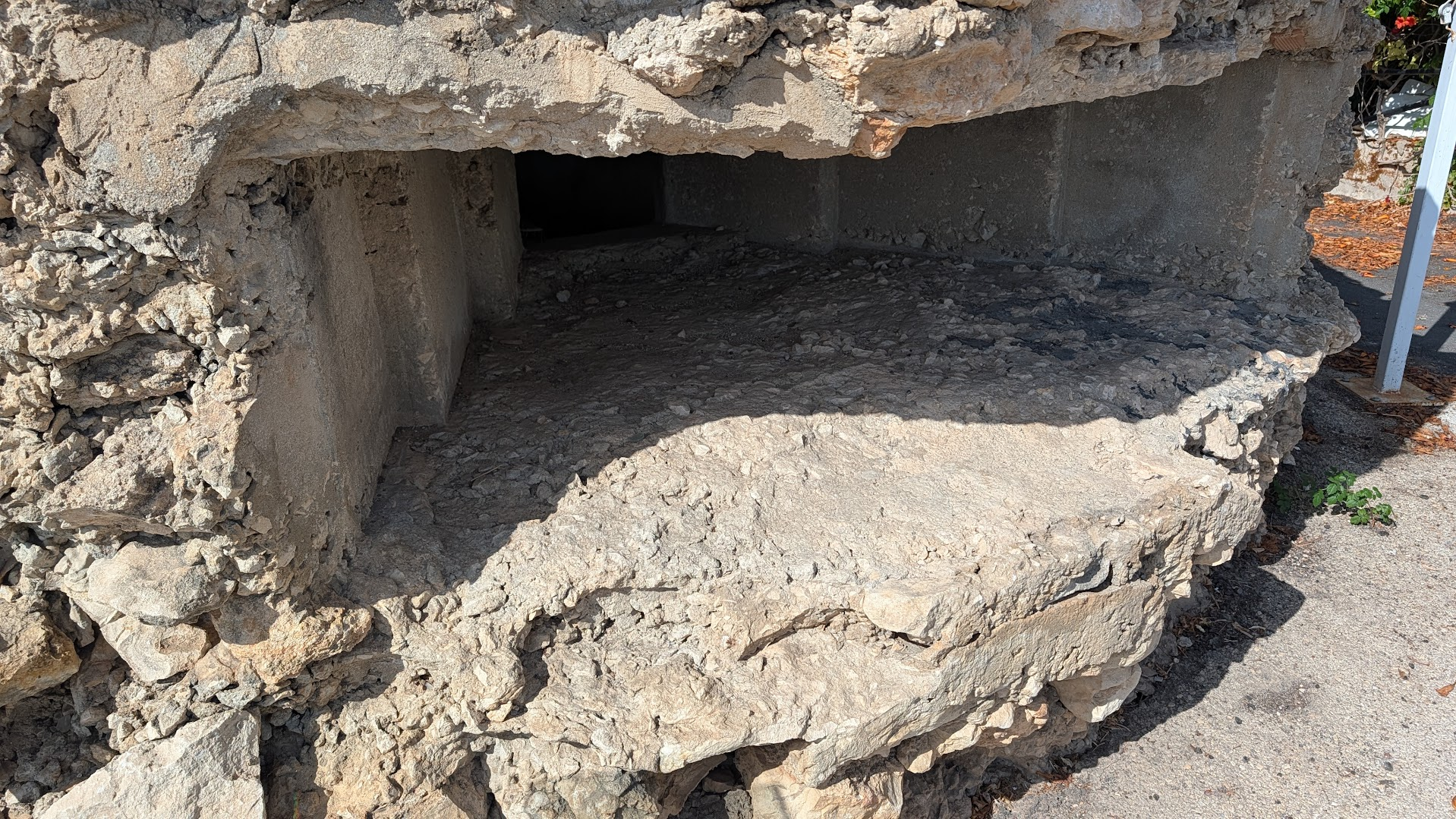 Interior view of the firing slit inside the restored WWII coastal bunker at Santa Croce Camerina, Sicily