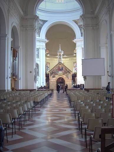 The nave of Santa Maria degli Angeli, with the small Porziuncola chapel standing under the dome