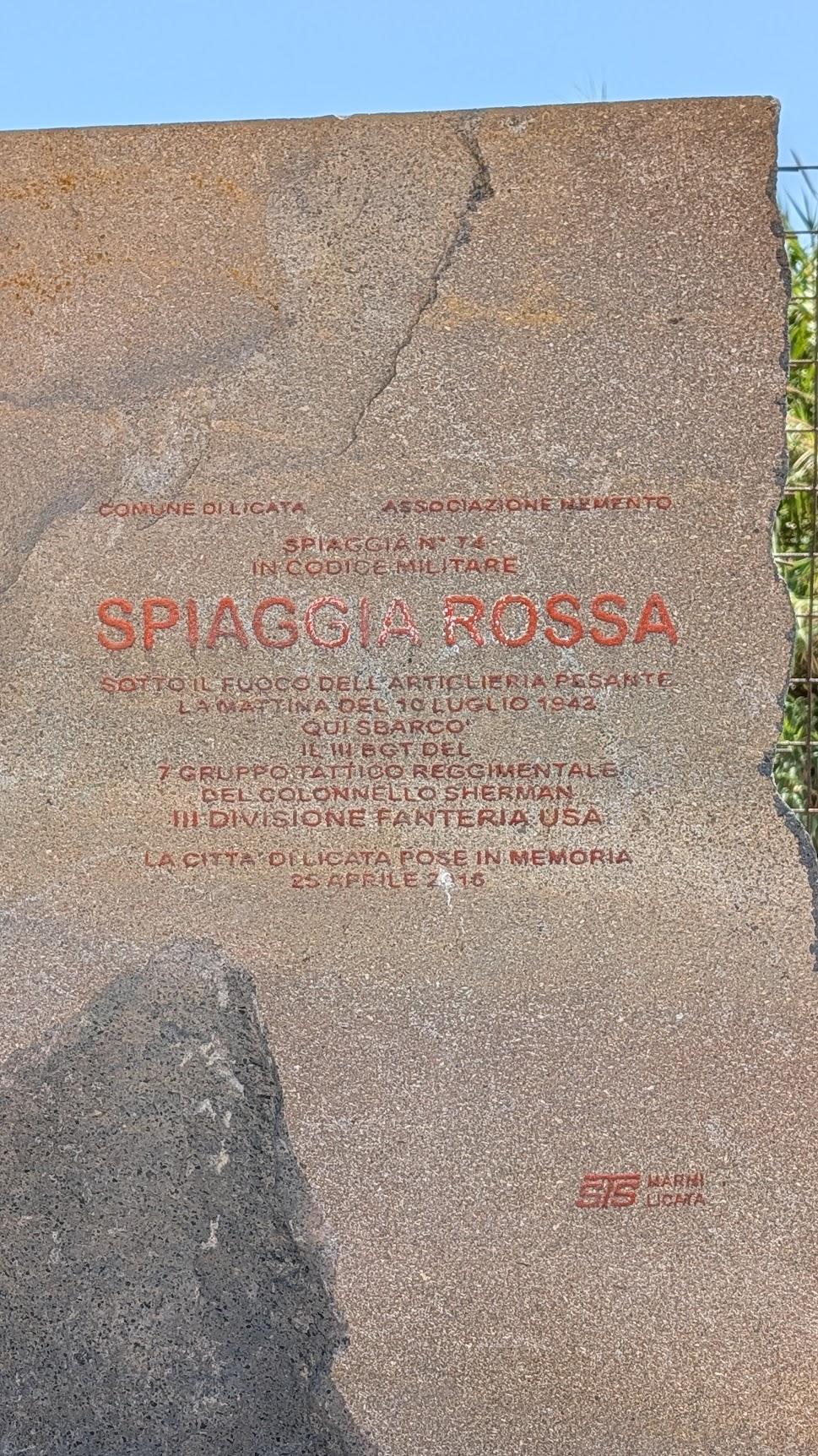Close-up of the Red Beach plaque text at Licata, naming Colonel Sherman's 7th Regimental Combat Team and the 3rd US Infantry Division